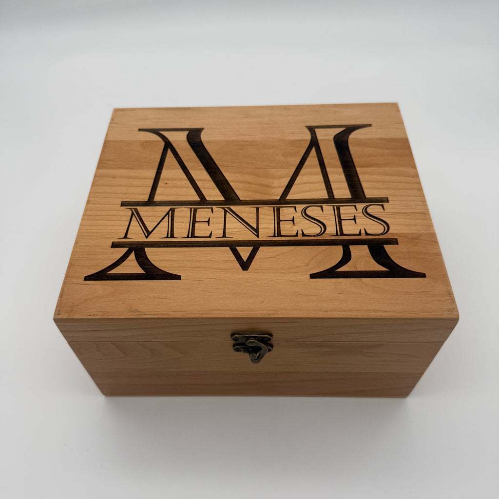 Light hardwood gift box lid engraved with a monogram and family name